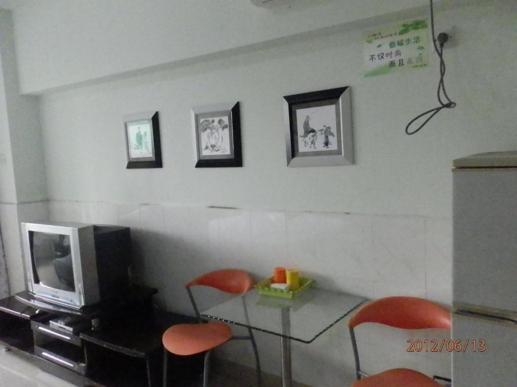 Xingfu Hotel Nanning Zimmer foto