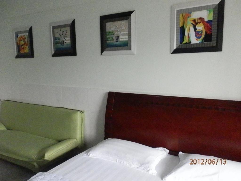 Xingfu Hotel Nanning Zimmer foto