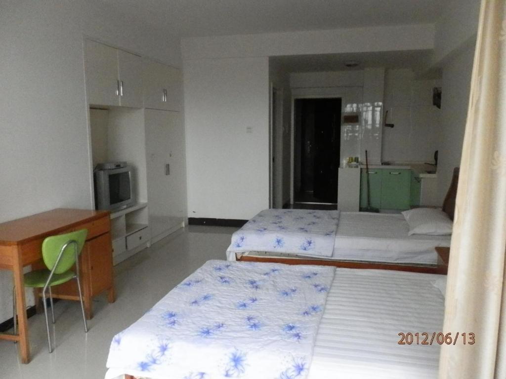 Xingfu Hotel Nanning Zimmer foto