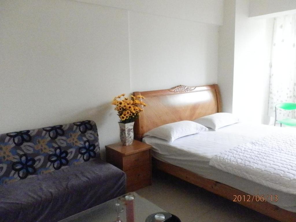 Xingfu Hotel Nanning Zimmer foto